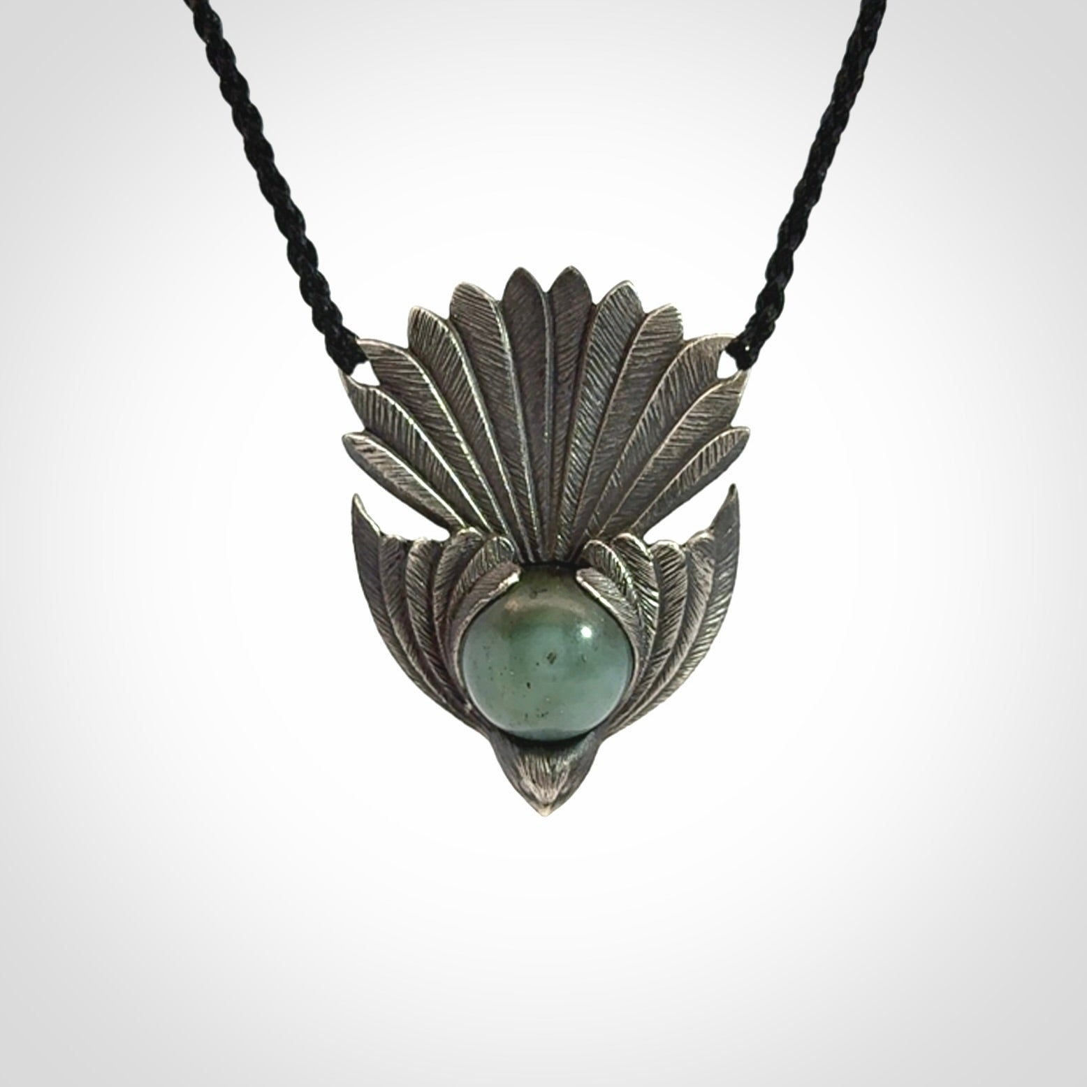 Hand crafted sterling silver fantail pendant with jade insert