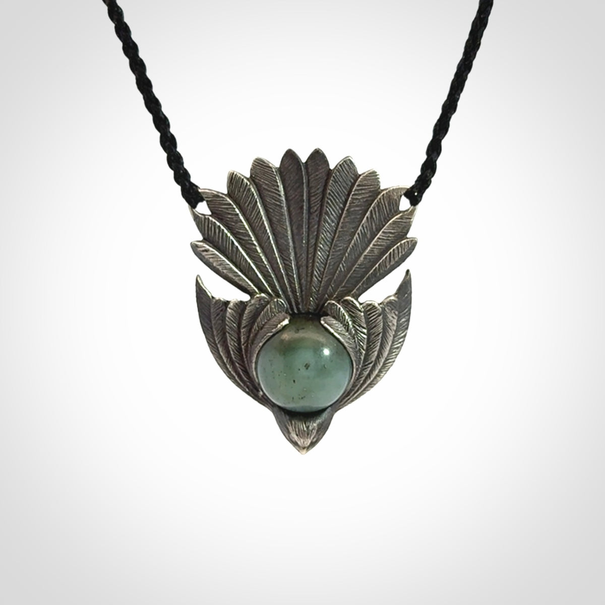 Hand crafted sterling silver fantail pendant with jade insert