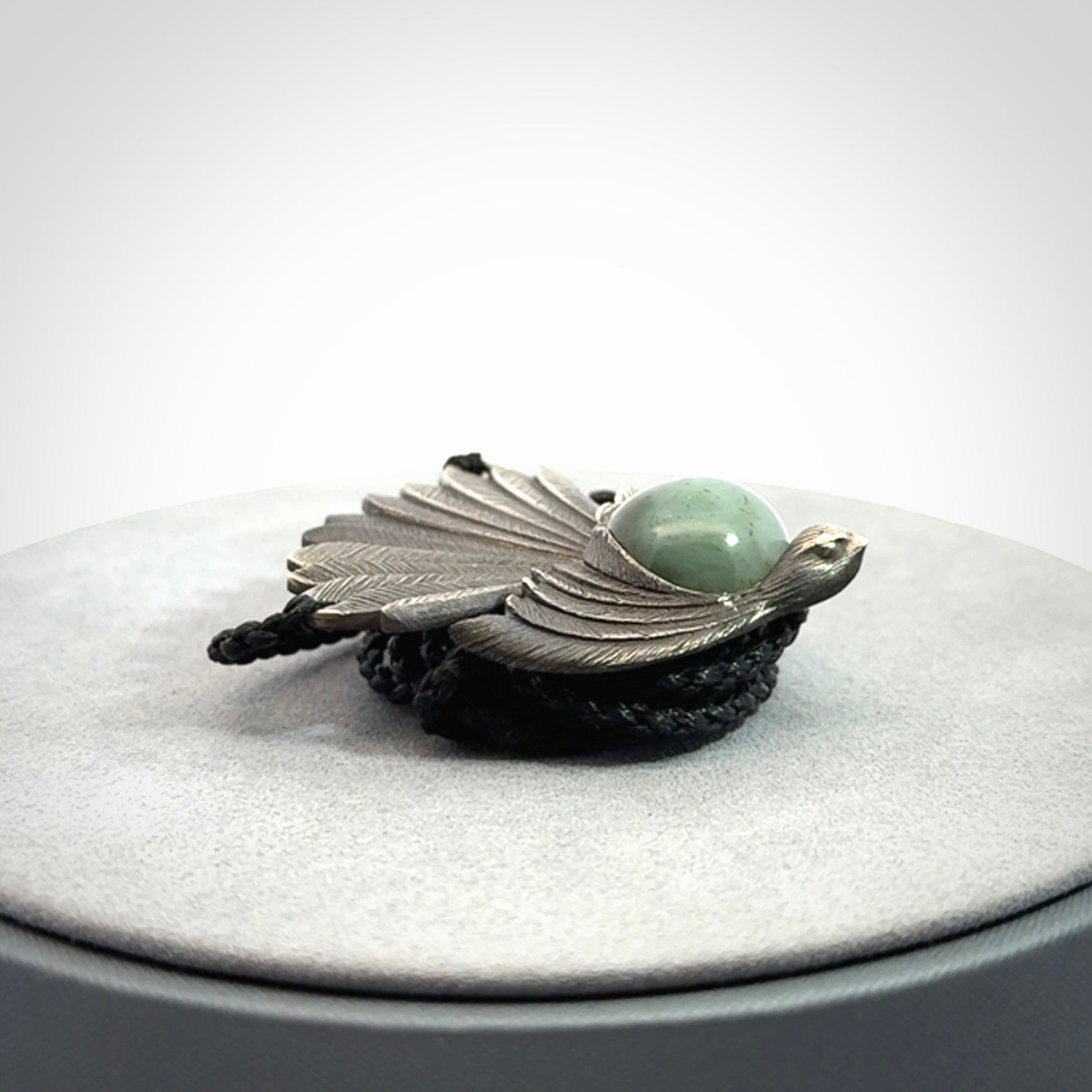 Hand crafted sterling silver fantail pendant with jade insert