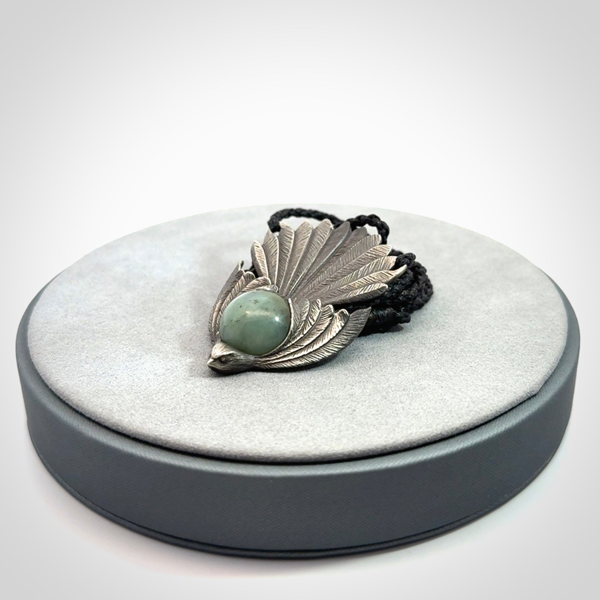 Hand crafted sterling silver fantail pendant with jade insert