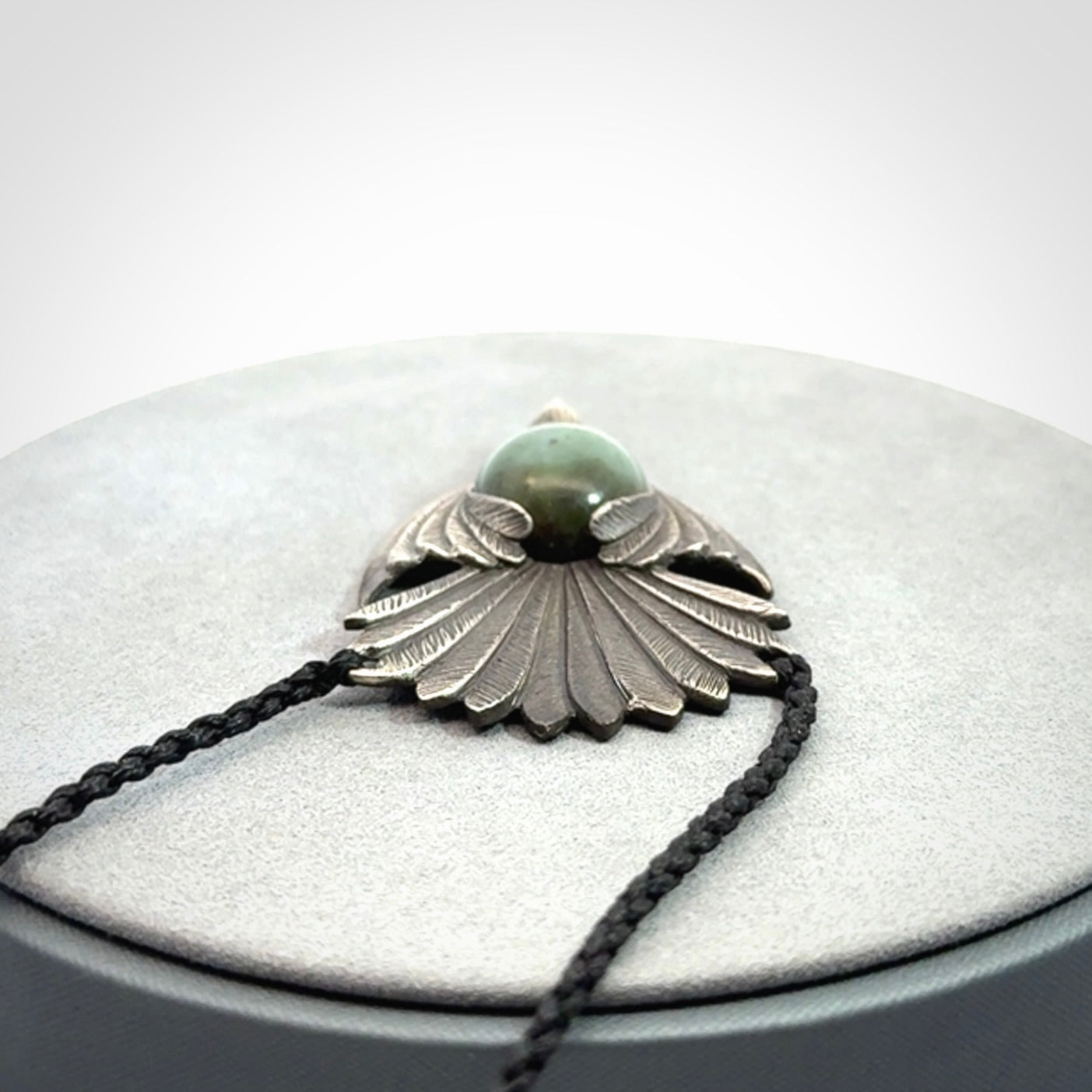 Hand crafted sterling silver fantail pendant with jade insert