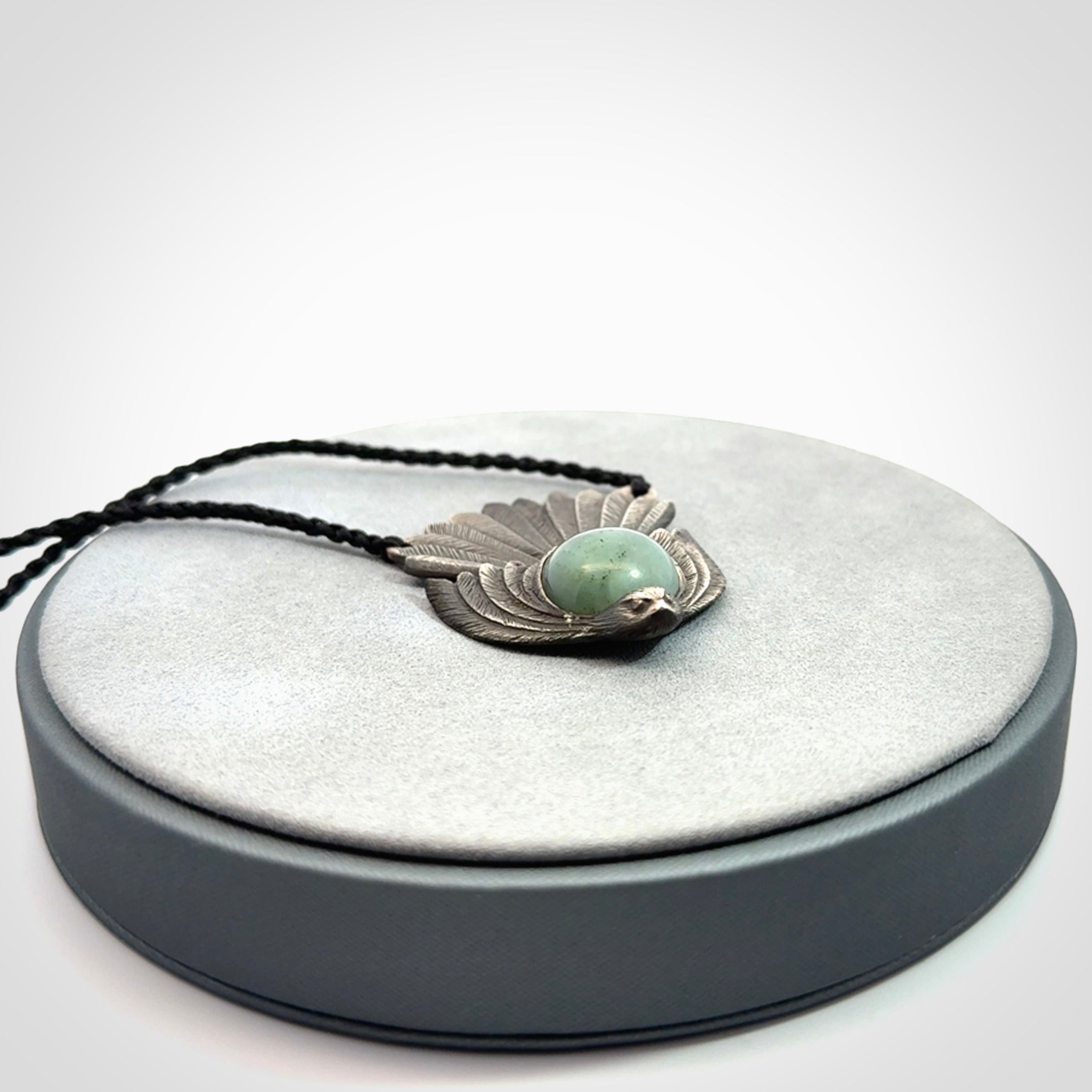 Hand crafted sterling silver fantail pendant with jade insert