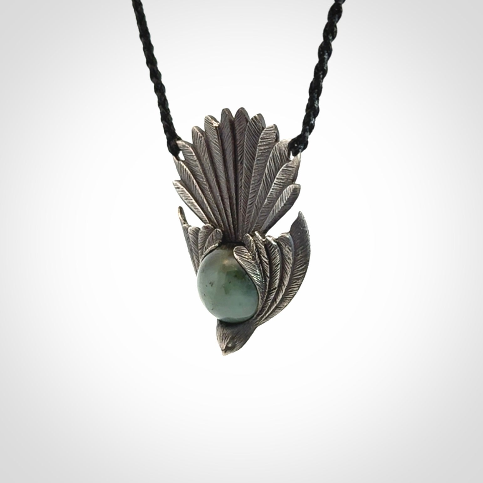 Hand crafted sterling silver fantail pendant with jade insert