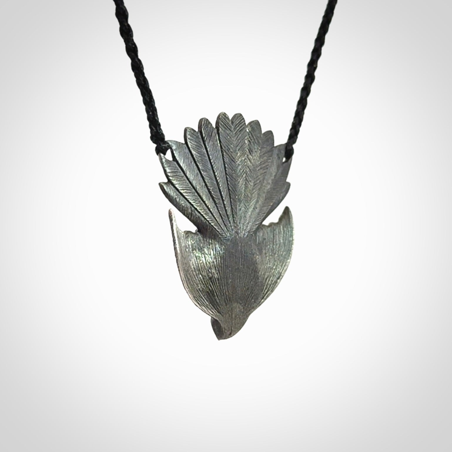 Hand crafted sterling silver fantail pendant with jade insert