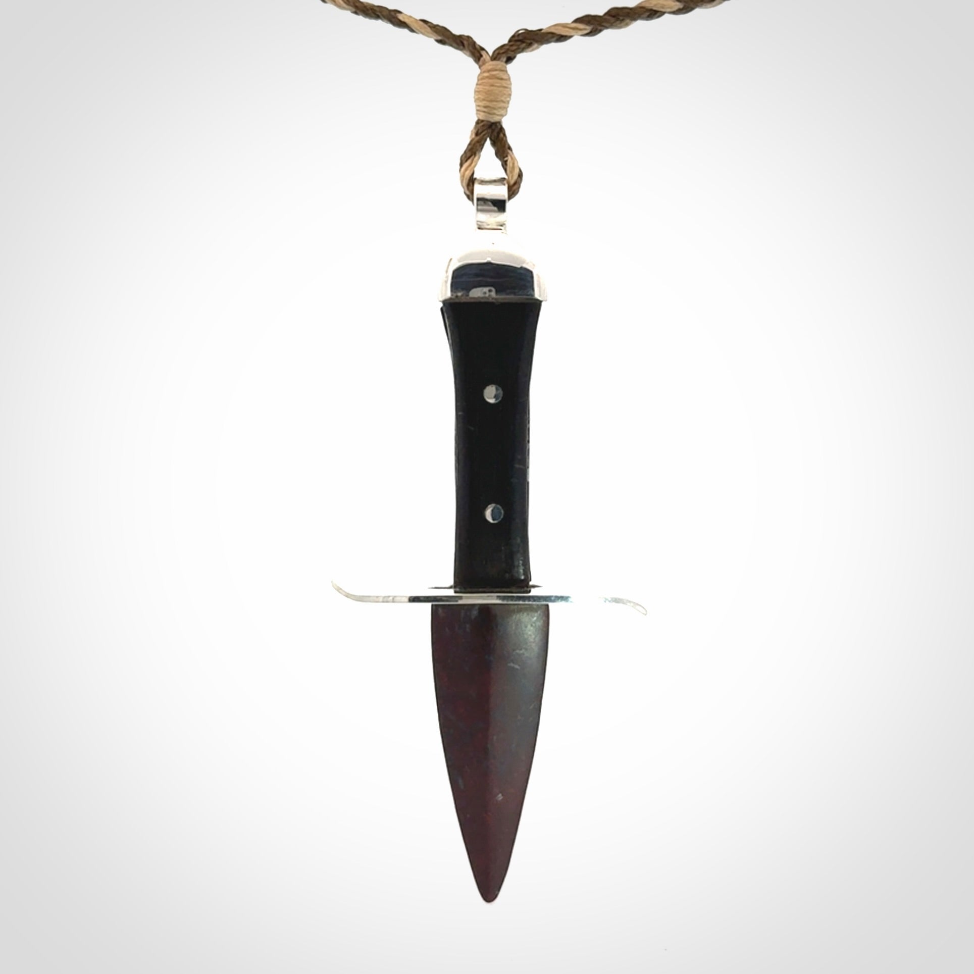 A striking hand carved knife pendant. These are carved with a Red Jasper Stone head and a hardwood handle. The cords are hand plaited in our waxed polyester which is robust, strong and durable. We ship these worldwide with express courier.