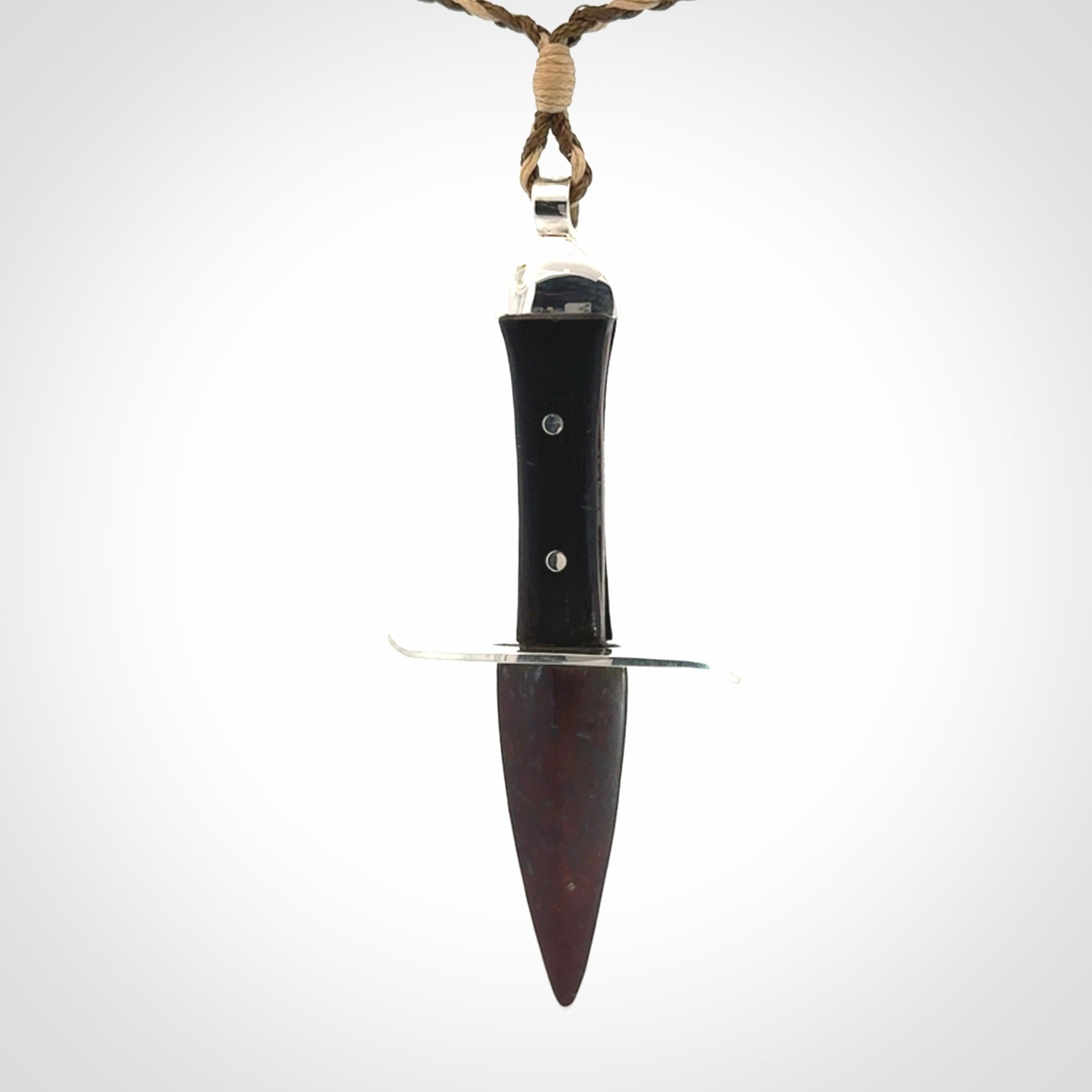 A striking hand carved knife pendant. These are carved with a Red Jasper Stone head and a hardwood handle. The cords are hand plaited in our waxed polyester which is robust, strong and durable. We ship these worldwide with express courier.