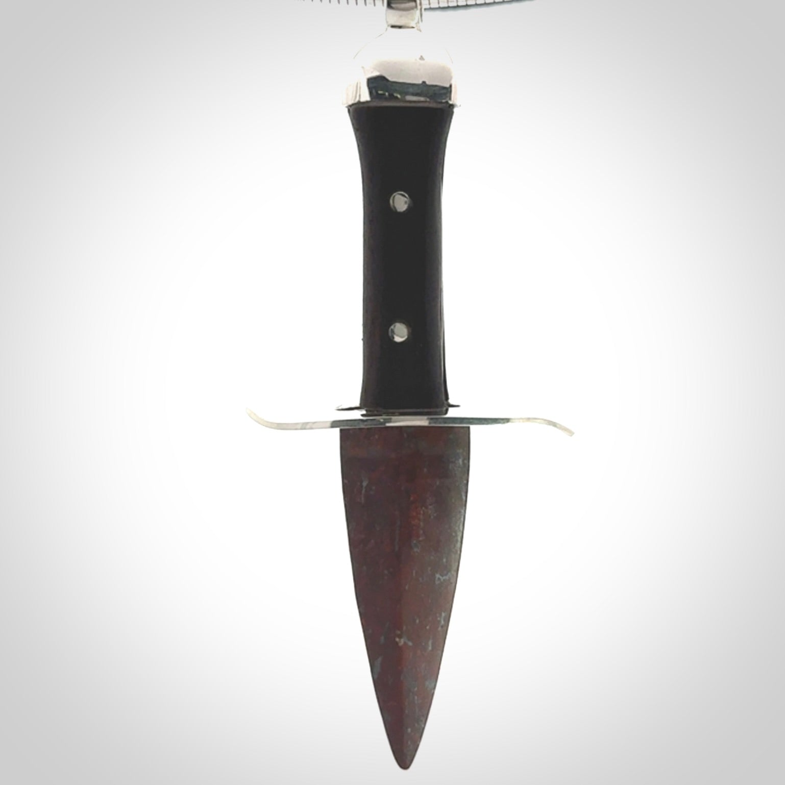 A striking hand carved dagger pendant. These are carved with a Red Jasper Stone head and a hardwood handle. It is provided with a Sterling Silver chain. We ship these worldwide with express courier.