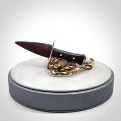 A striking hand carved knife pendant. These are carved with a Red Jasper Stone head and a hardwood handle. The cords are hand plaited in our waxed polyester which is robust, strong and durable. We ship these worldwide with express courier.