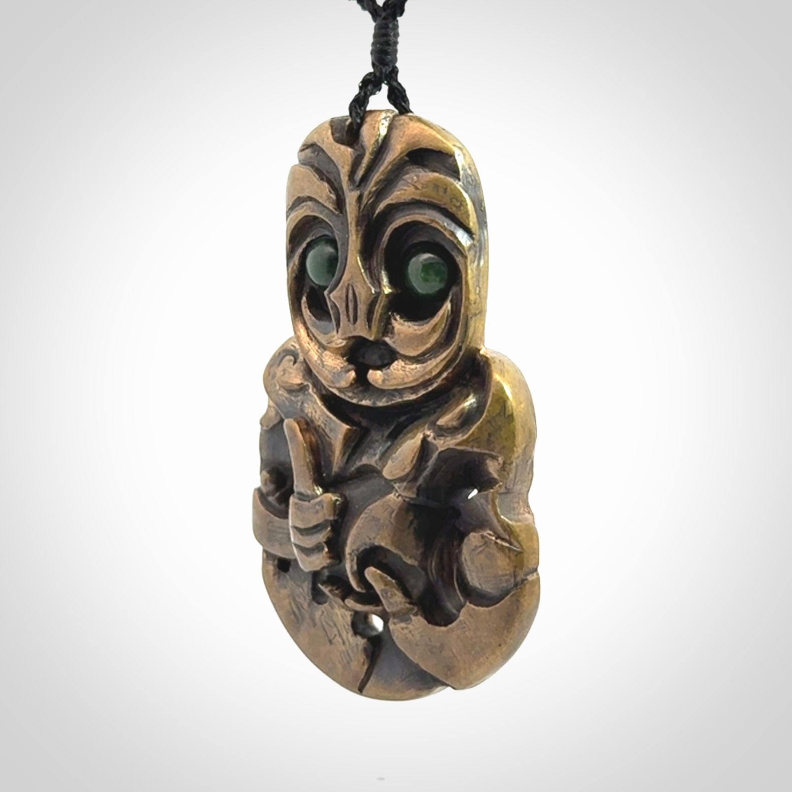 A beautiful hand made, bronze tiki pendant.