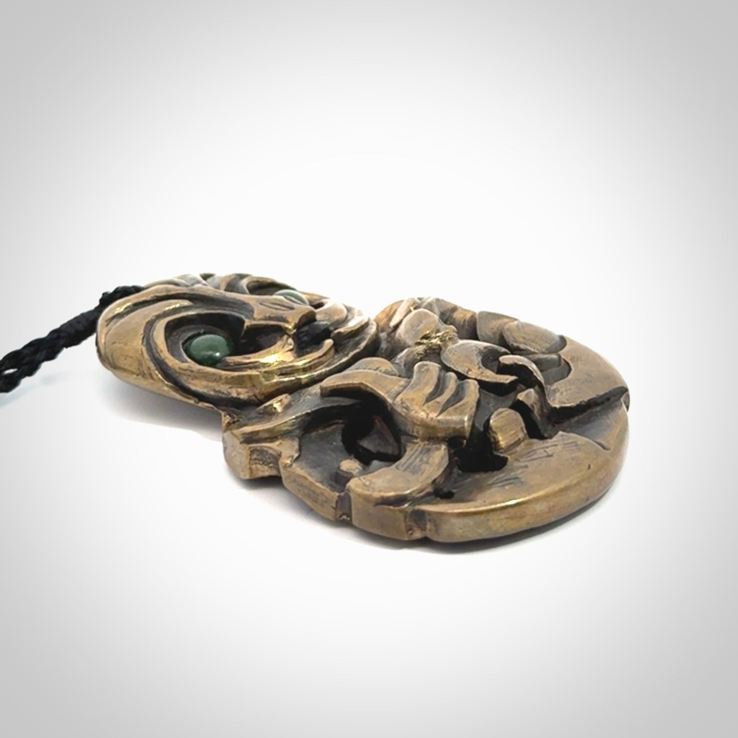 A beautiful hand made, bronze tiki pendant.