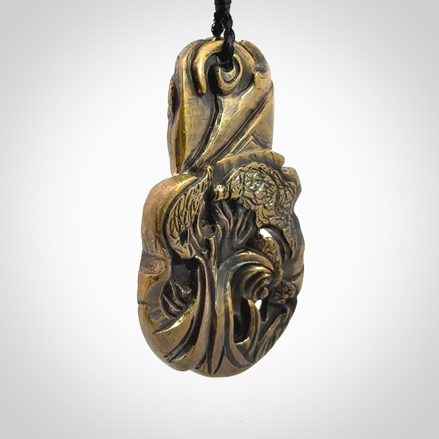 A beautiful hand made, bronze tiki pendant.