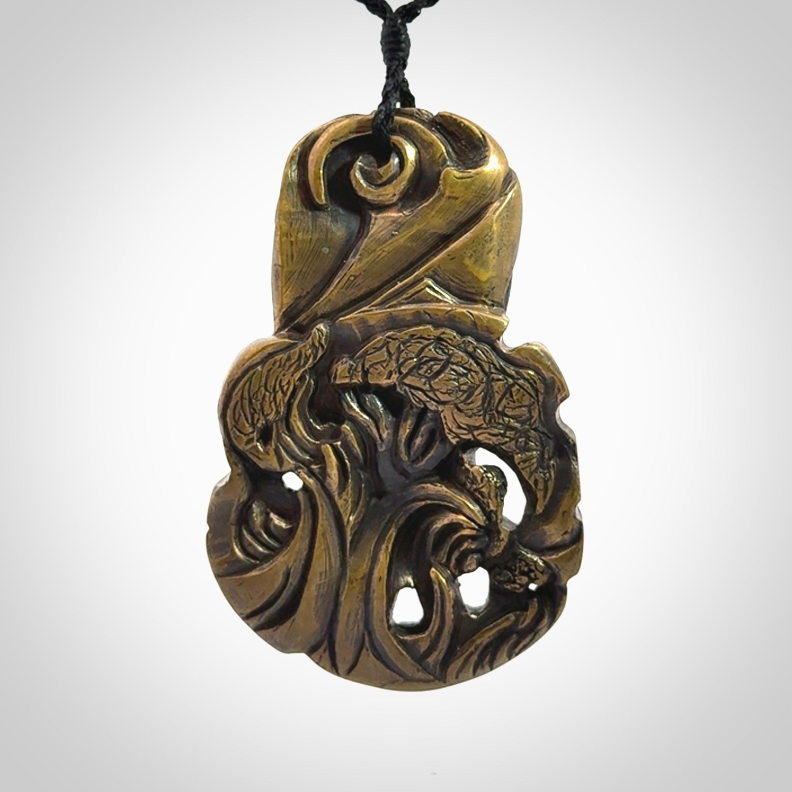 A beautiful hand made, bronze tiki pendant.
