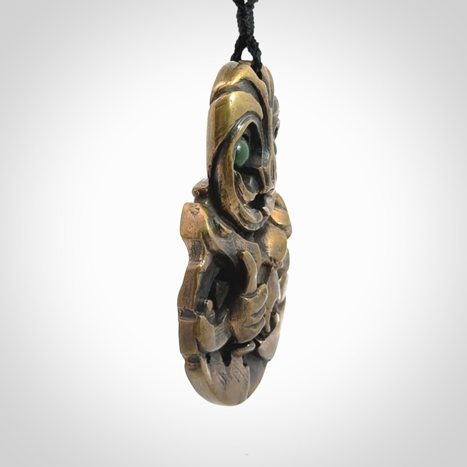 A beautiful hand made, bronze tiki pendant.