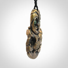A beautiful hand made, bronze tiki pendant.