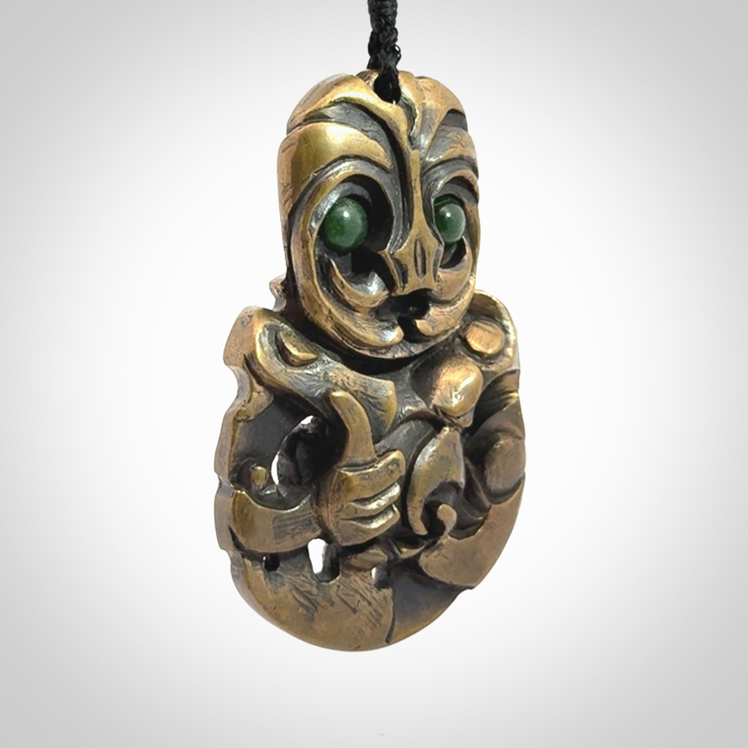 A beautiful hand made, bronze tiki pendant.