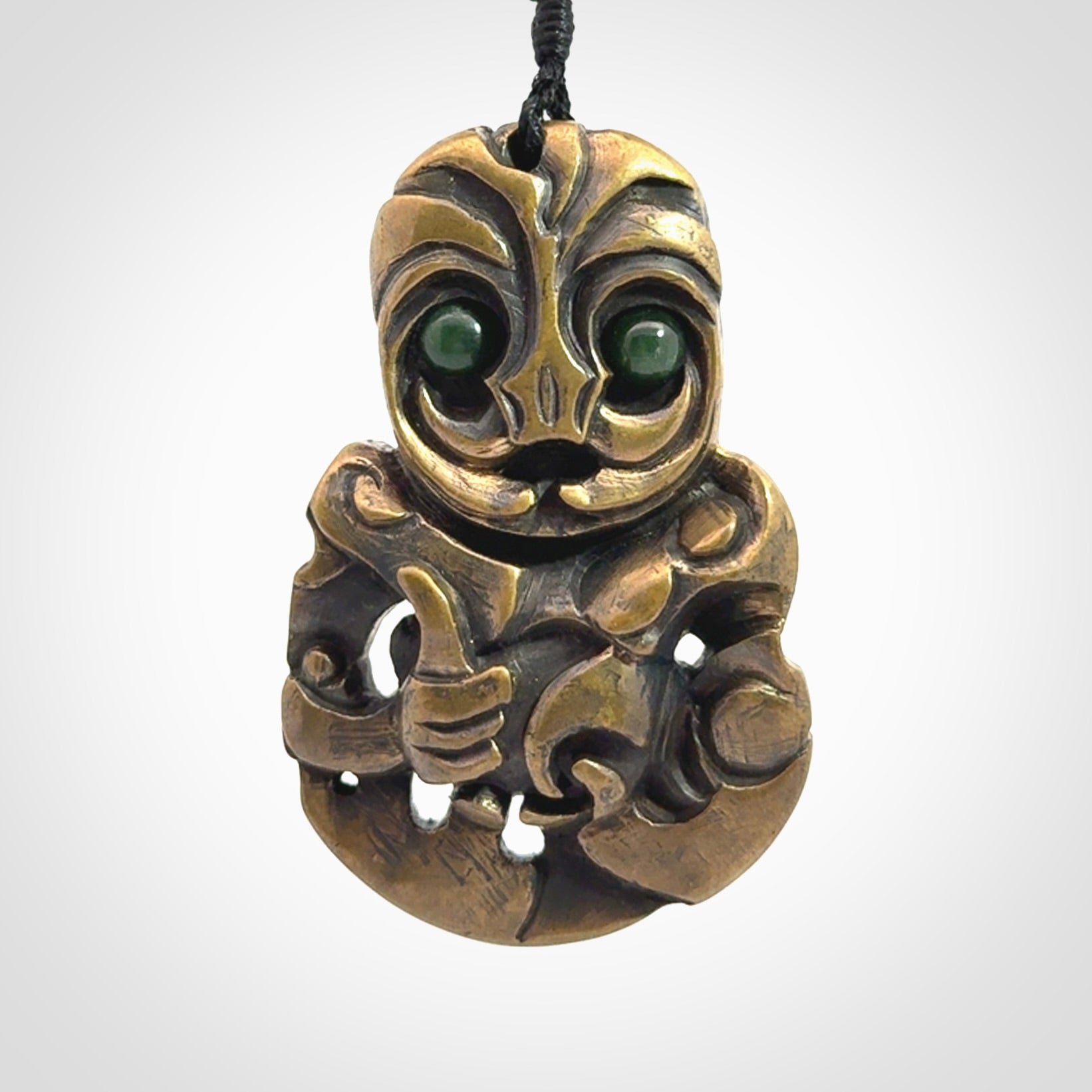 A beautiful hand made, bronze tiki pendant.