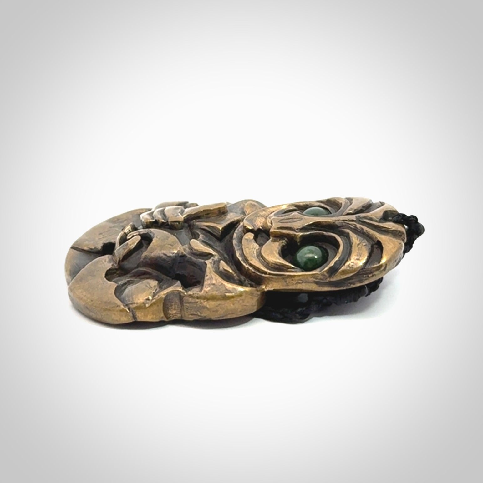 A beautiful hand made, bronze tiki pendant.