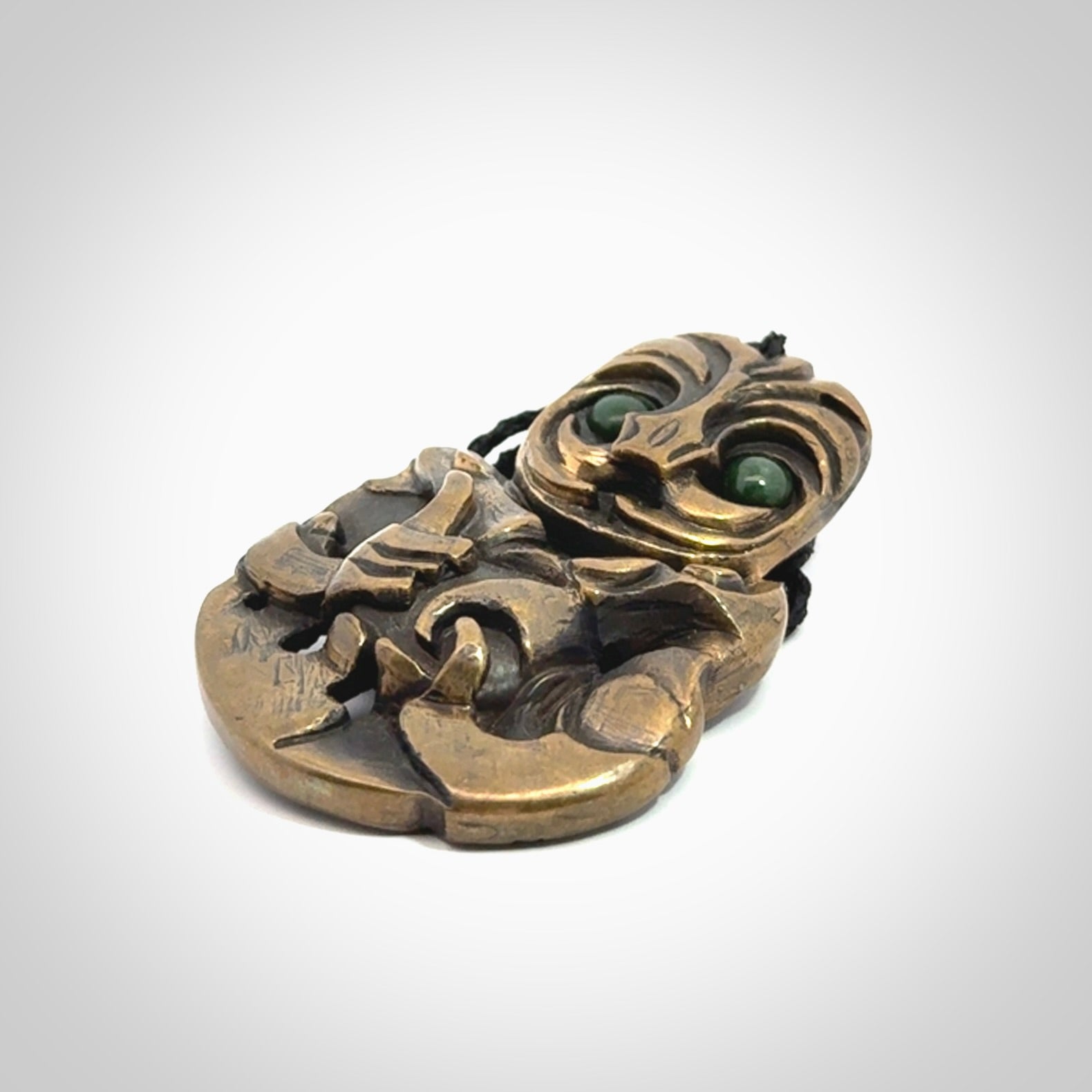 A beautiful hand made, bronze tiki pendant.