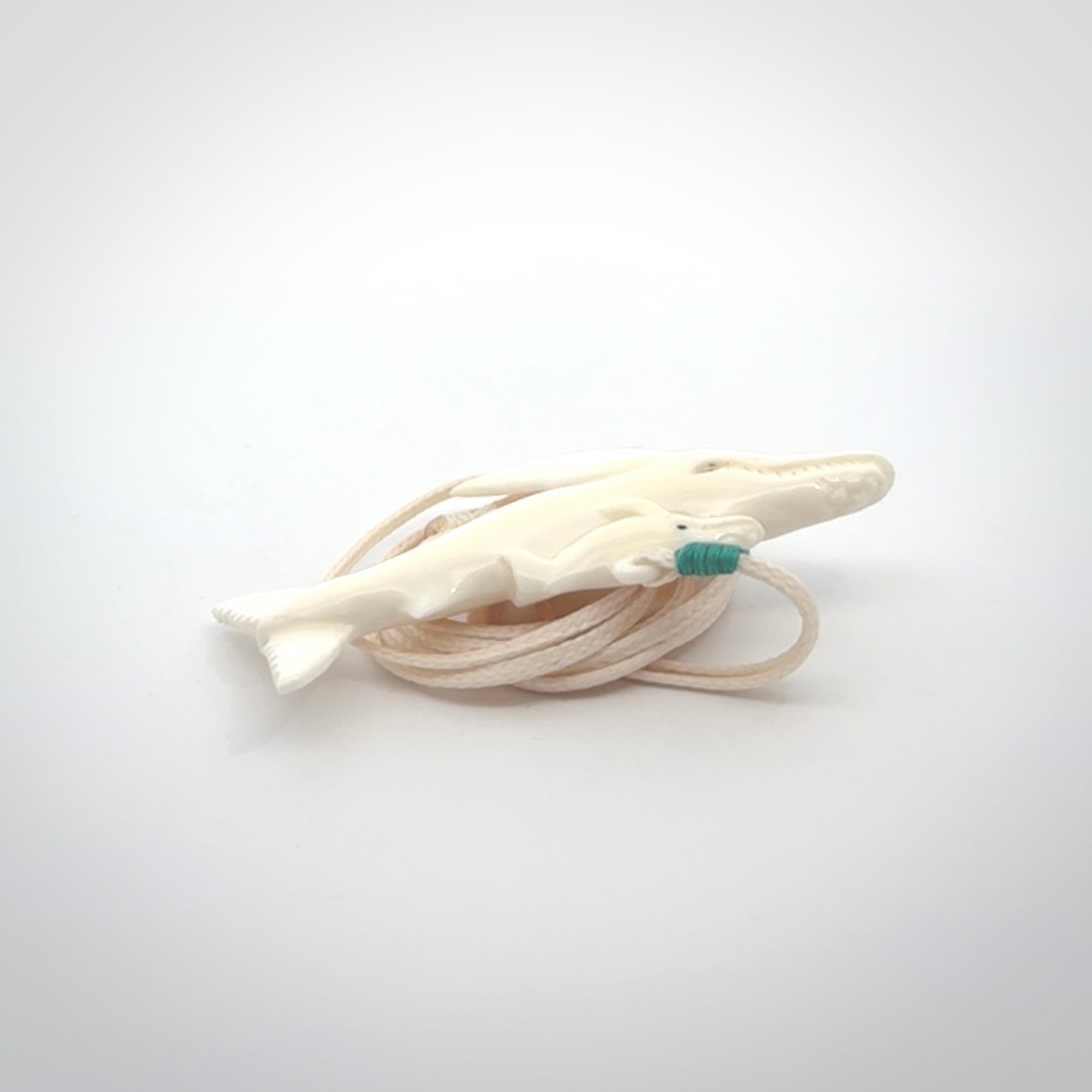 Hand carved bone whale pendant. Carved by NZ Pacific in natural bone.
