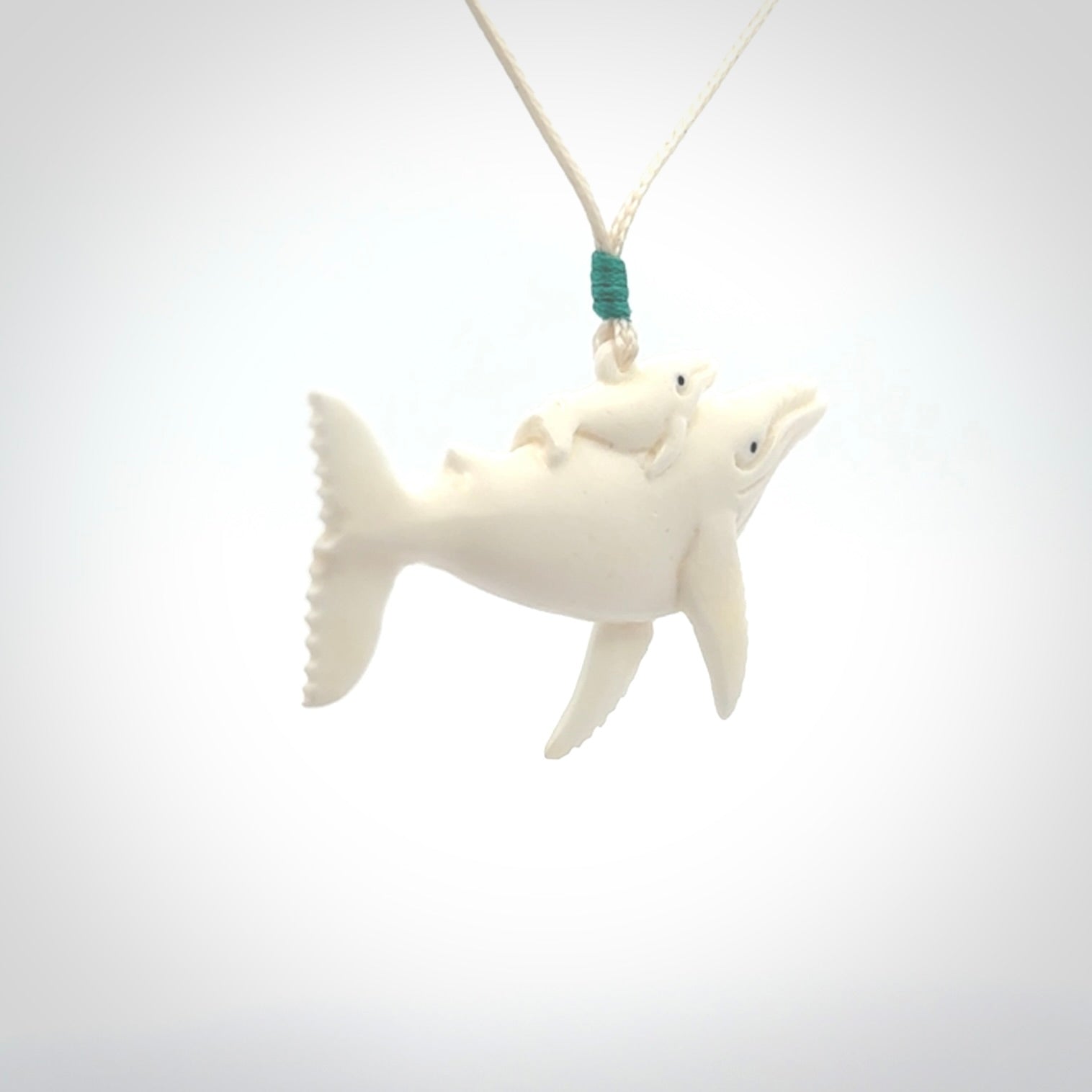 Hand carved bone whale pendant. Carved by NZ Pacific in natural bone.