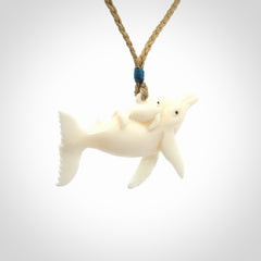 Hand carved bone whale and whale calf pendant