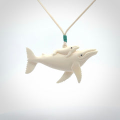Hand carved bone whale pendant. Carved by NZ Pacific in natural bone.