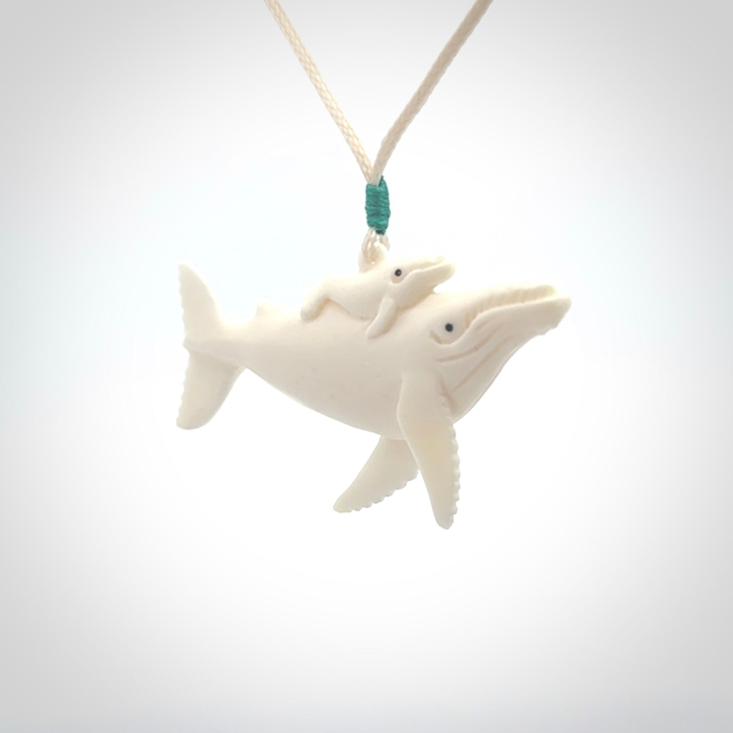 Hand carved bone whale pendant. Carved by NZ Pacific in natural bone.