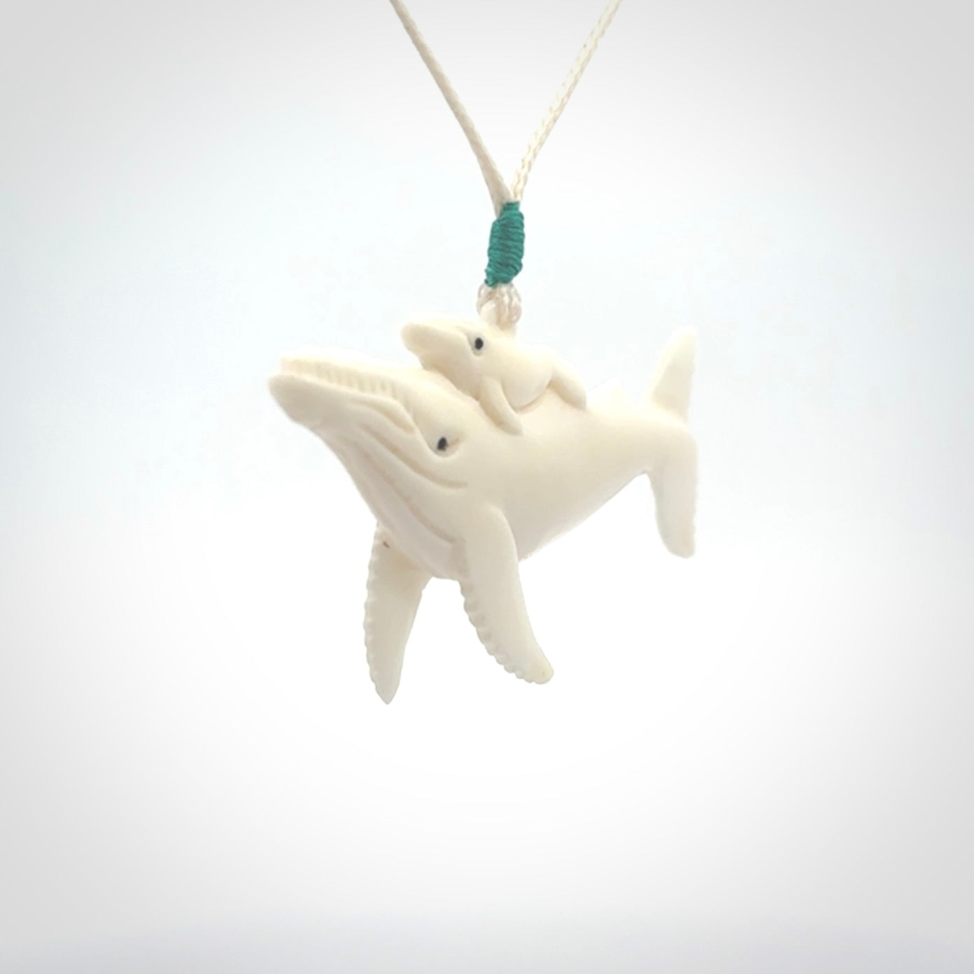 Hand carved bone whale pendant. Carved by NZ Pacific in natural bone.