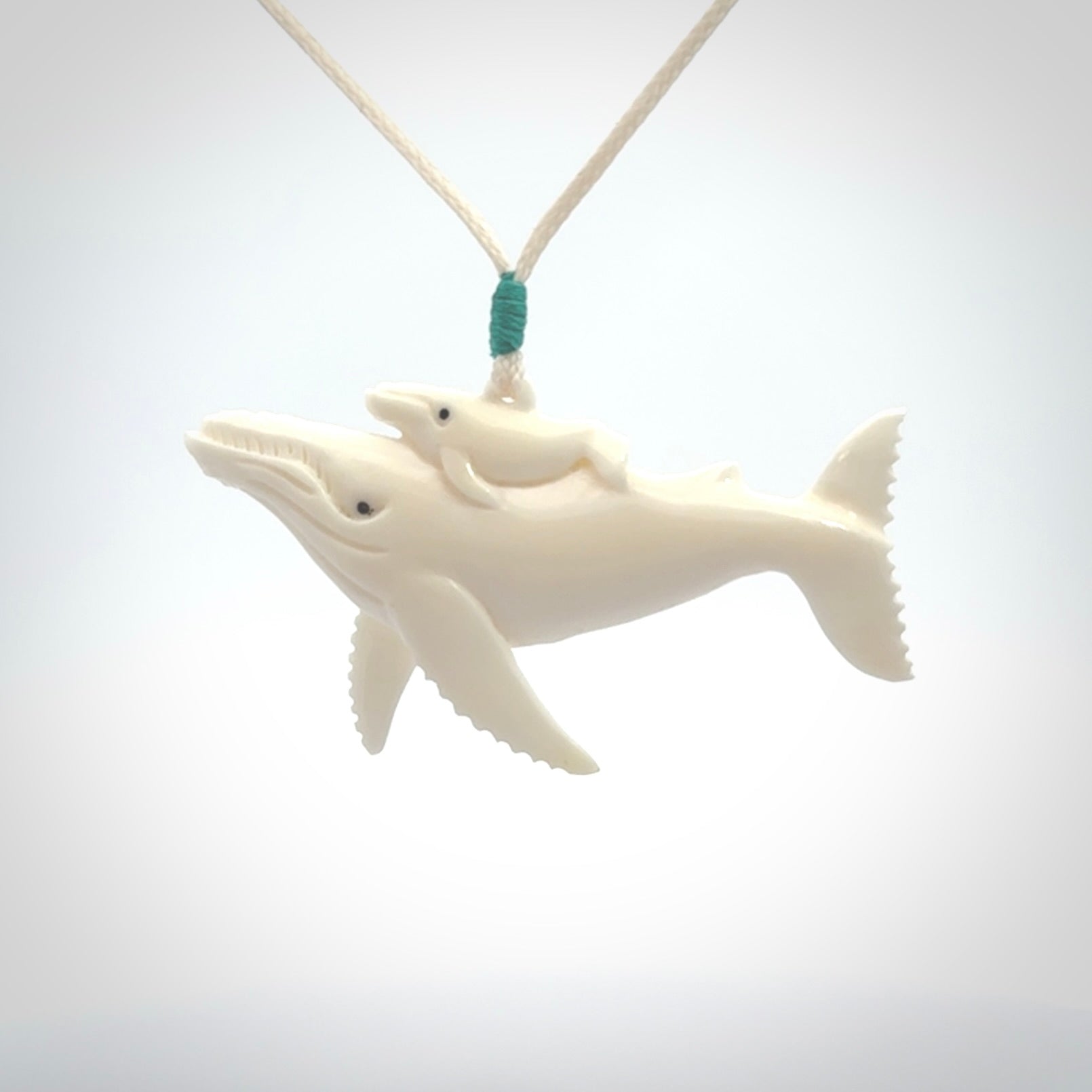 Hand carved bone whale pendant. Carved by NZ Pacific in natural bone.