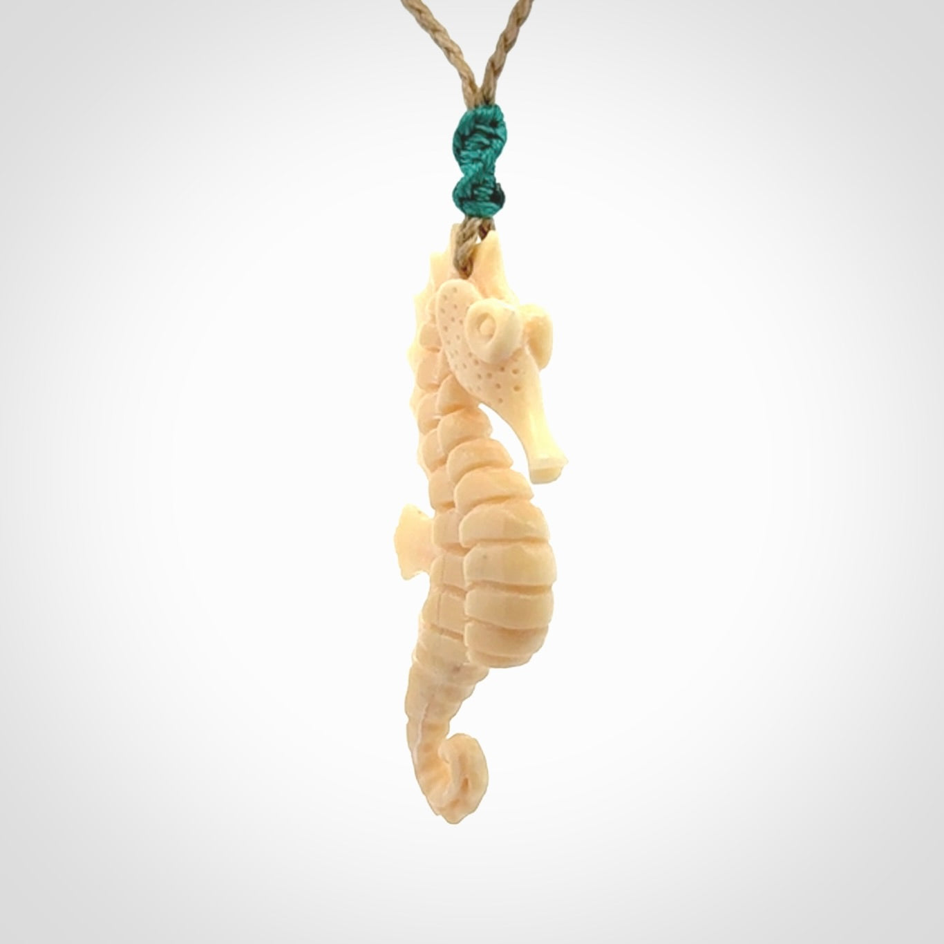 Hand carved woolly mammoth tusk seahorse pendant. Made by NZ Pacific.