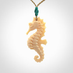 Hand carved woolly mammoth tusk seahorse pendant. Made by NZ Pacific.