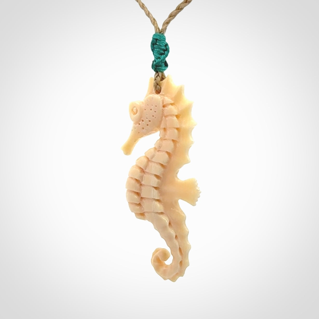Hand carved woolly mammoth tusk seahorse pendant. Made by NZ Pacific.