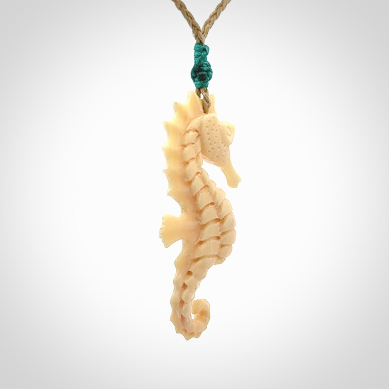 Hand carved woolly mammoth tusk seahorse pendant. Made by NZ Pacific.