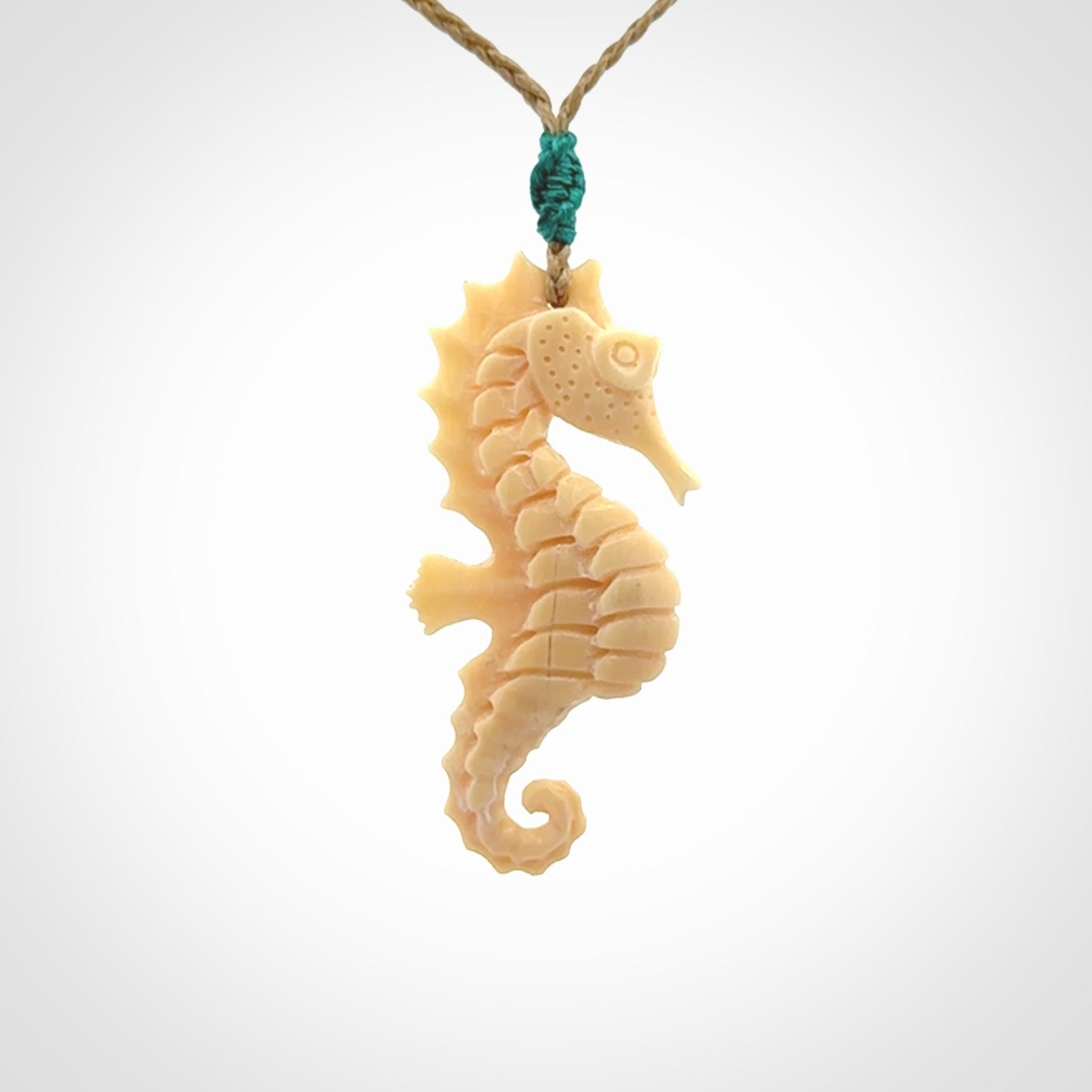 Hand carved woolly mammoth tusk seahorse pendant. Made by NZ Pacific.