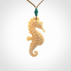 Hand carved woolly mammoth tusk seahorse pendant. Made by NZ Pacific.