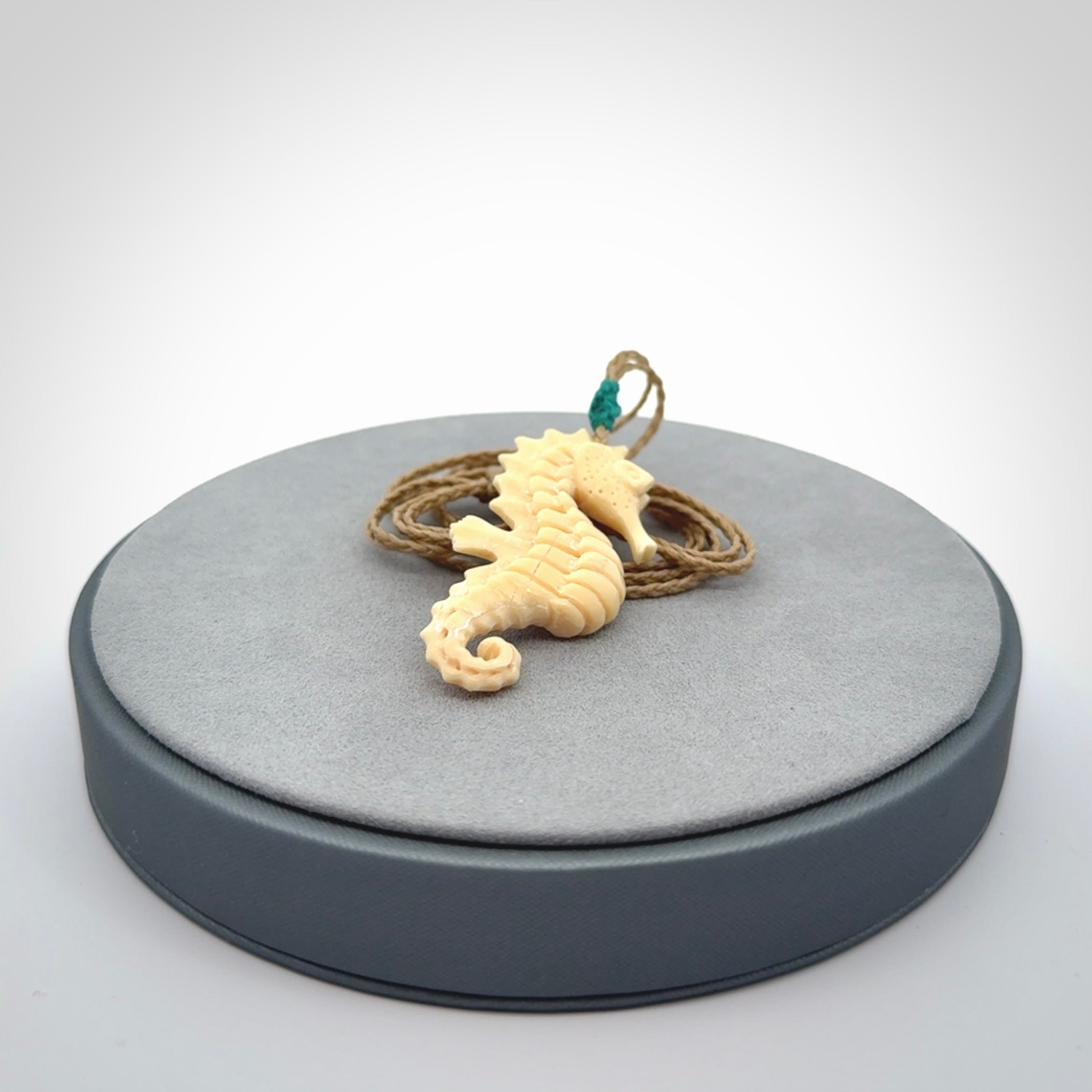 Hand carved woolly mammoth tusk seahorse pendant. Made by NZ Pacific.