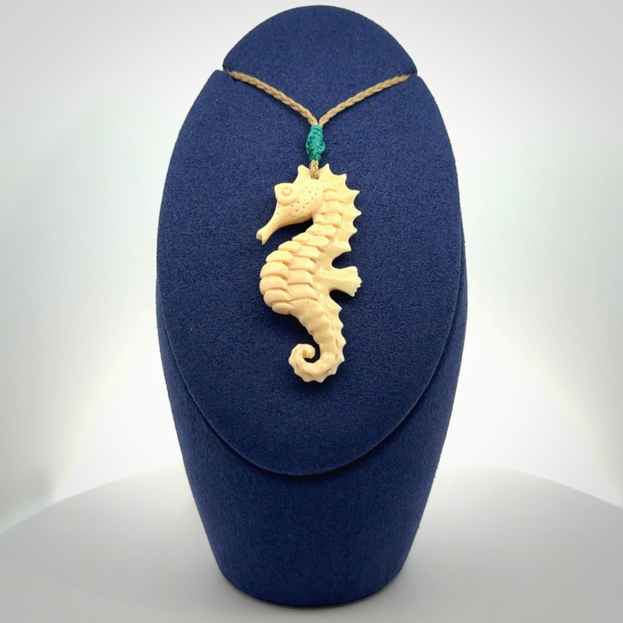 Hand carved woolly mammoth tusk seahorse pendant. Made by NZ Pacific.
