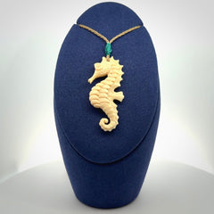 Hand carved woolly mammoth tusk seahorse pendant. Made by NZ Pacific.