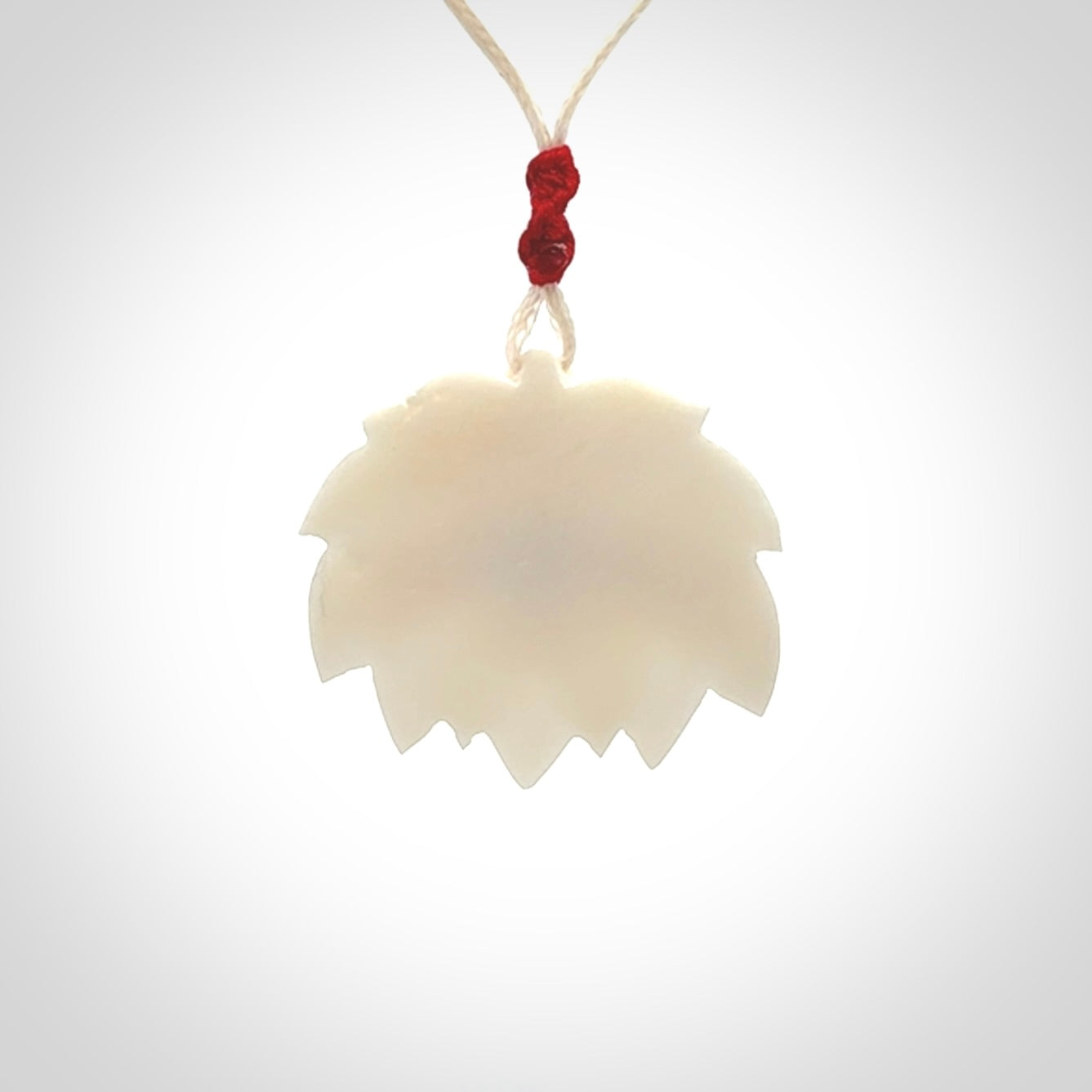 This is a hand carved lotus flower pendant. It is made from bone. This is a medium sized necklace and is a very unique pendant and is a wonderful necklace to wear. Hand carved bone lotus flower pendant with adjustable cord.