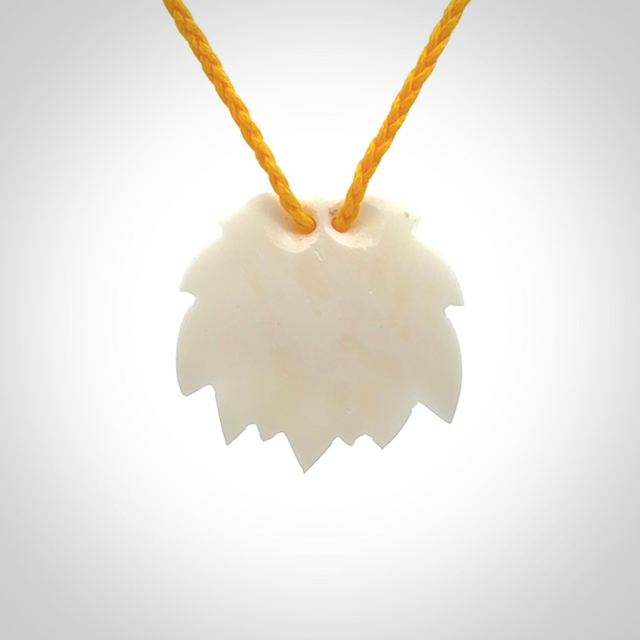 This is a hand carved lotus flower pendant. It is made from bone. This is a medium sized necklace and is a very unique pendant and is a wonderful necklace to wear. Hand carved bone lotus flower pendant with adjustable cord.