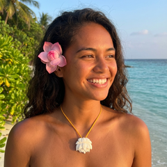 Woman wearing bone lotus pendant