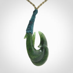 Hand carved double Jade matau hook pendant. The cord is length adjustable.