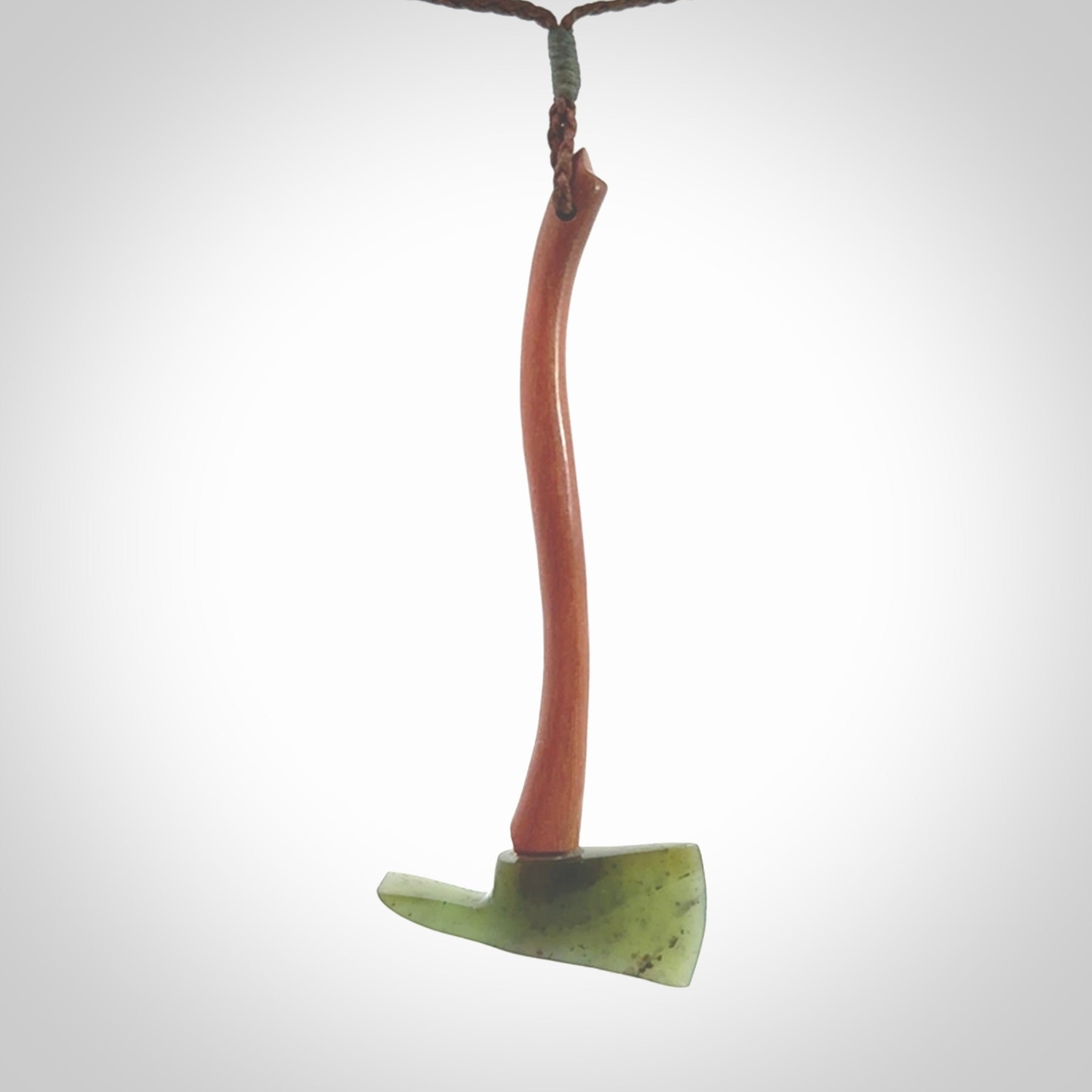 A striking hand carved Pulaski axe pendant for firemen and firewoman. These are carved with a jade or black jade head and a hardwood handle. The cords are hand plaited in our waxed polyester which is robust, strong and durable. We ship these worldwide with express courier.