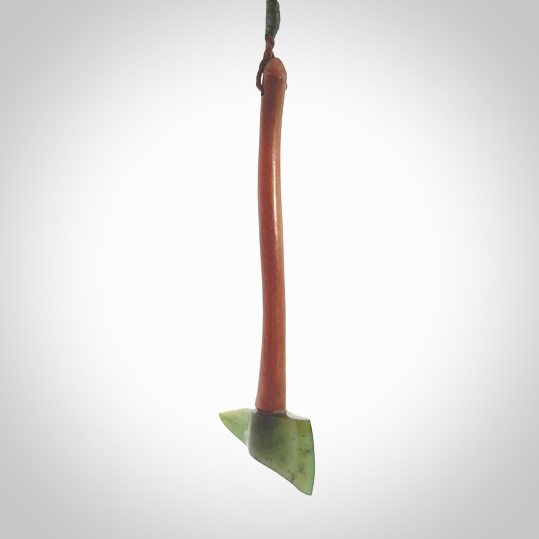 A striking hand carved Pulaski axe pendant for firemen and firewoman. These are carved with a jade or black jade head and a hardwood handle. The cords are hand plaited in our waxed polyester which is robust, strong and durable. We ship these worldwide with express courier.