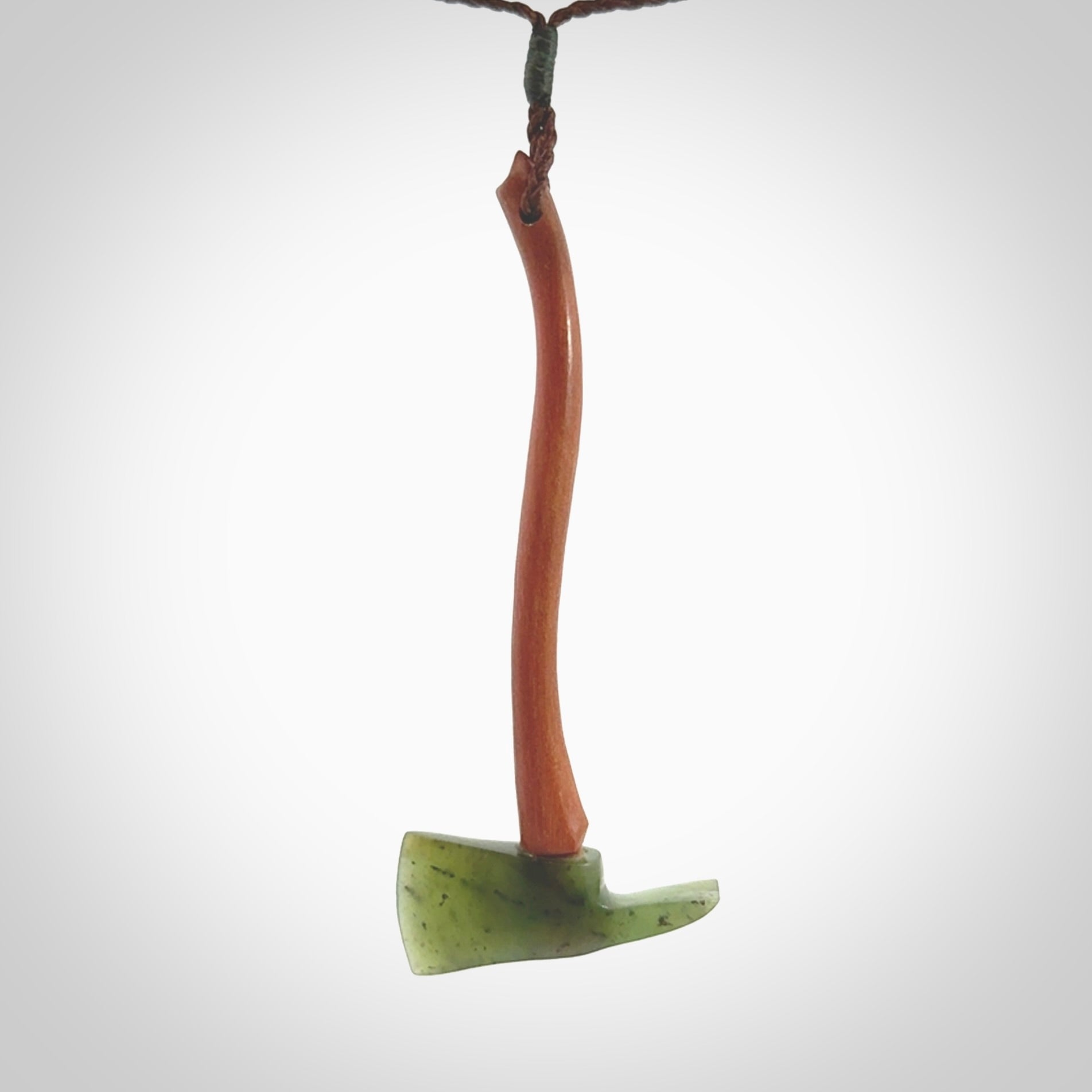 A striking hand carved Pulaski axe pendant for firemen and firewoman. These are carved with a jade or black jade head and a hardwood handle. The cords are hand plaited in our waxed polyester which is robust, strong and durable. We ship these worldwide with express courier.