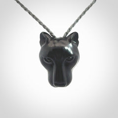 This pendant is a hand carved puma. We've carved this from a lovely piece of black jade and we provide it with a hand plaited cord. Shipping is free worldwide.