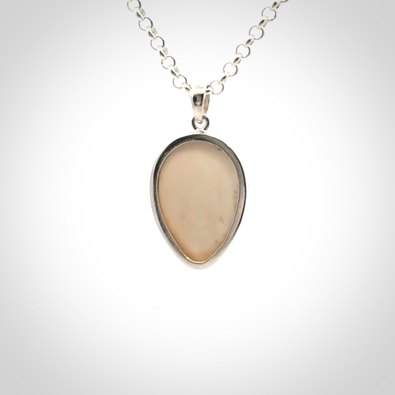 Hand made woolly mammoth tusk moon face necklace. Made by NZ Pacific and sale online only.