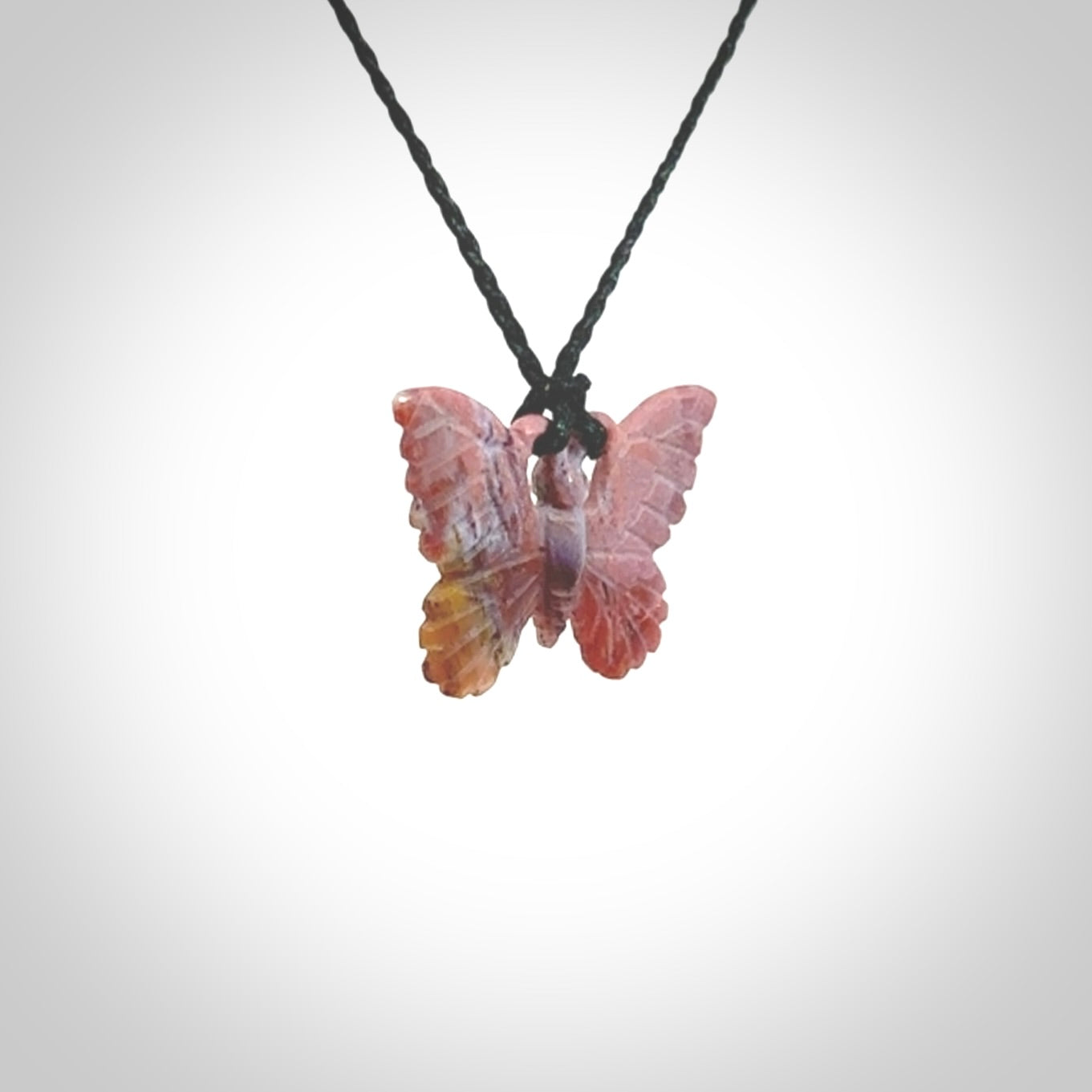 Small Butterfly design pendant carved in Red Agate. Real Agate jewellery for sale online with NZ Pacific. Small butterfly pendant hand made in red agate, provided with adjustable cord and packaged in a woven kete pouch.