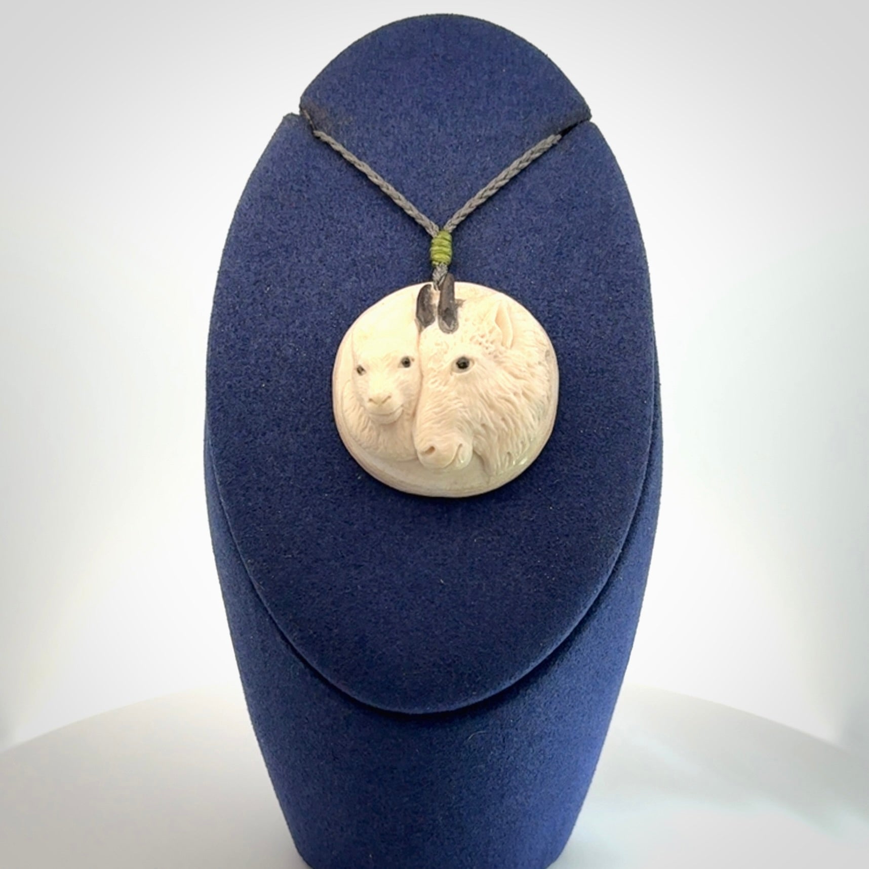 Merino and ewe pendant carved in mammoth tusk