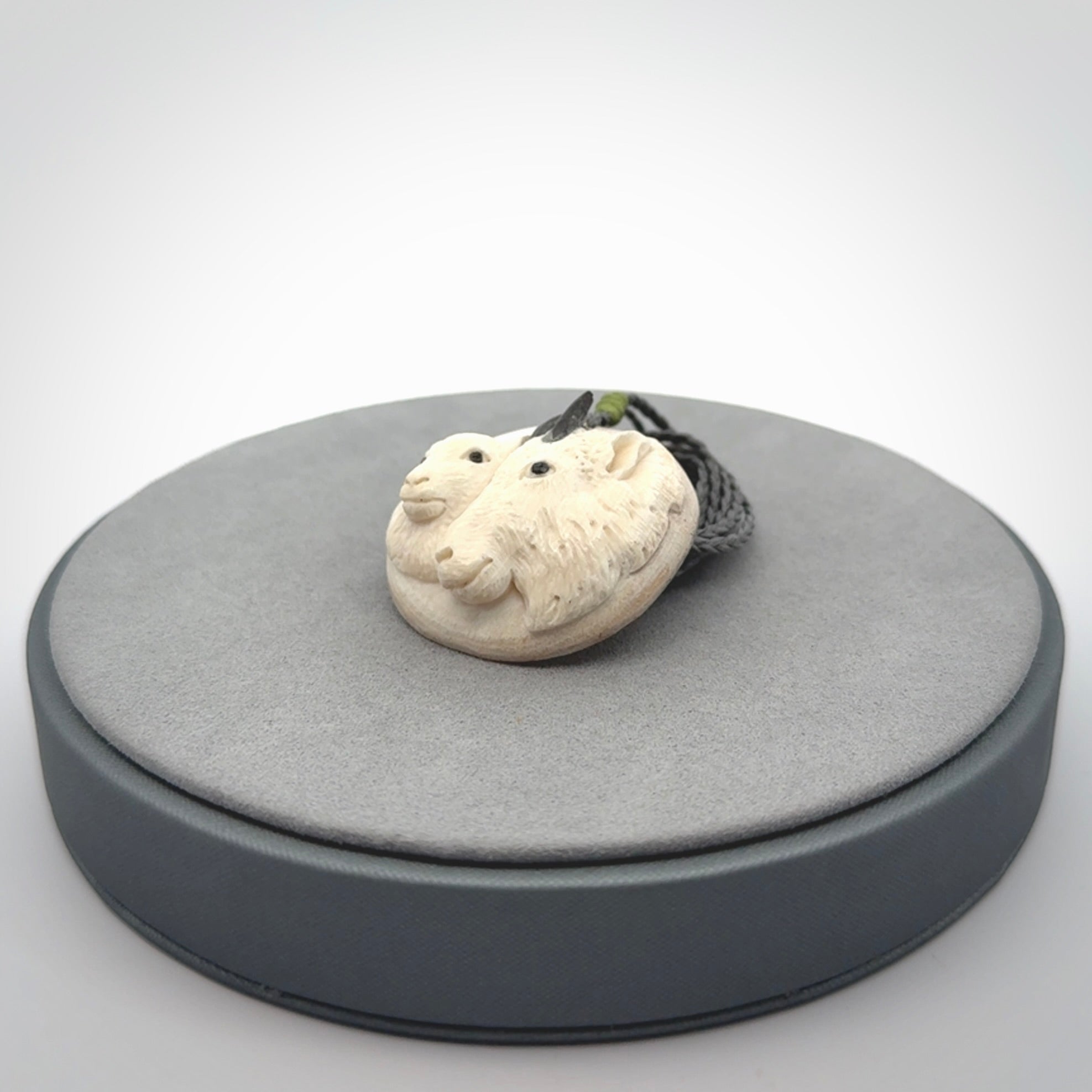 Merino and ewe pendant carved in mammoth tusk